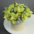 Композиция в шляпной коробке из 11 лаймовых орхидей в Апрелевке